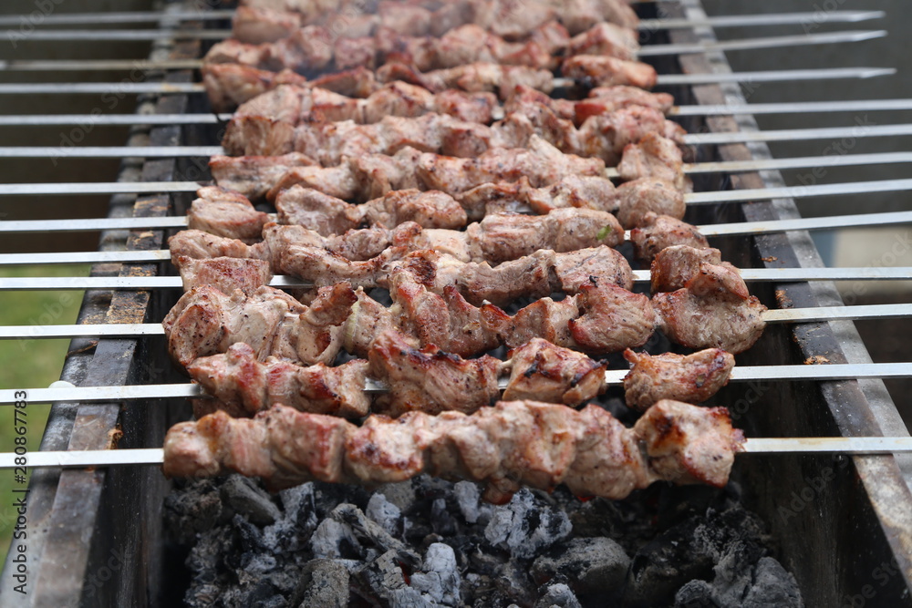 Roasted meat cooked at barbecue with smoke. Traditional eastern dish.