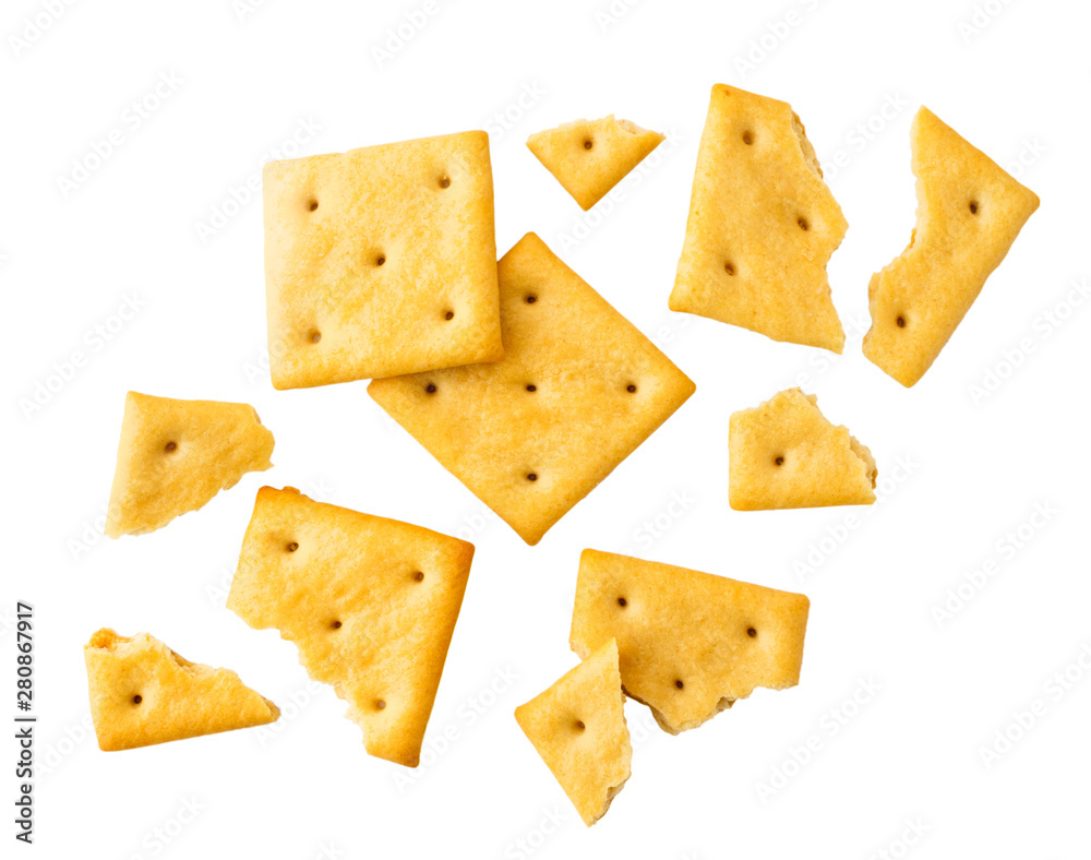 Cookies crackers and pieces are flying on a white. Isolated. Cookies crackers and pieces are flying on a white. Isolated.