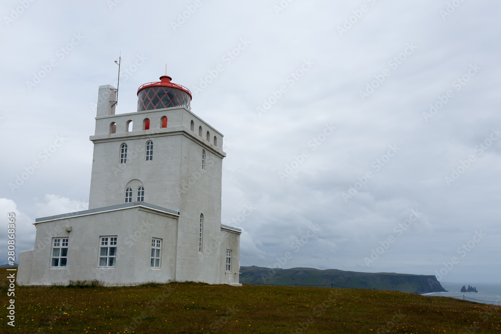 Dyrholaey lighthouse view. South Iceland landmark.
