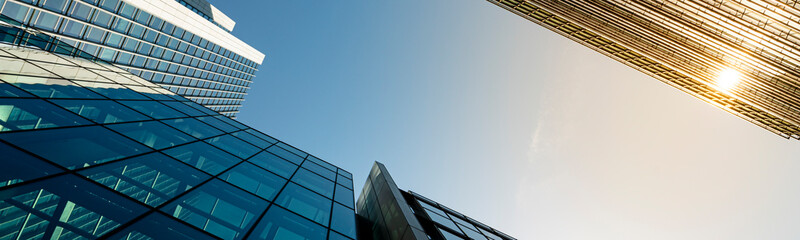 Modern city building architecture with glass fronts on a clear day in London, England panoramic