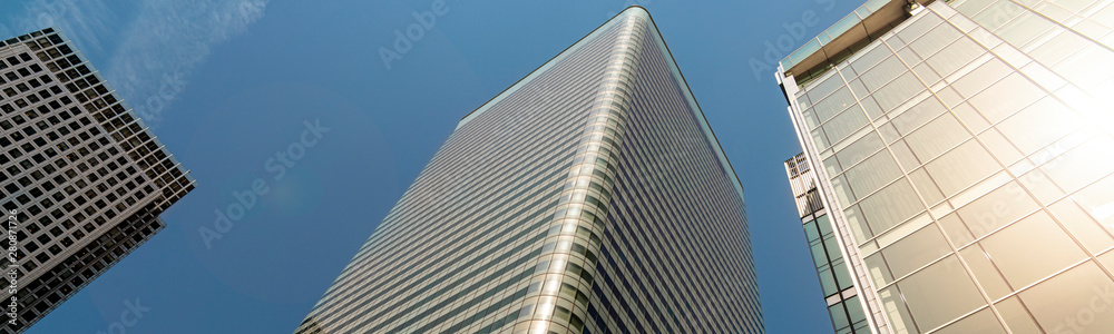 Modern city building architecture with glass fronts on a clear day in London, England panoramic