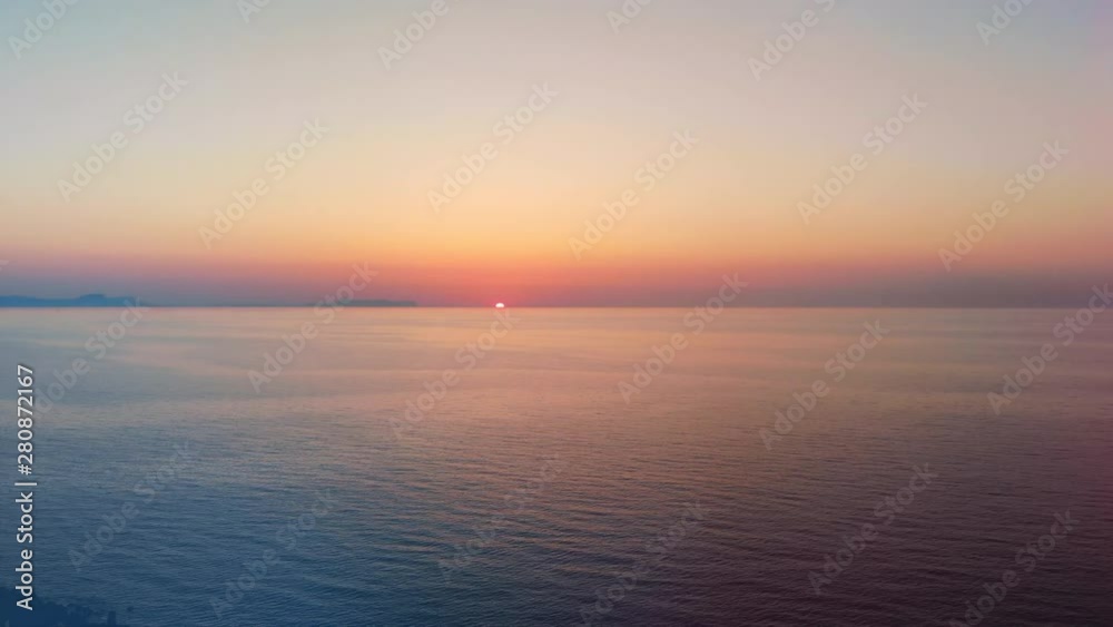 Sunset over blue sea at a resort. Sunset over blue sea at a resort.
