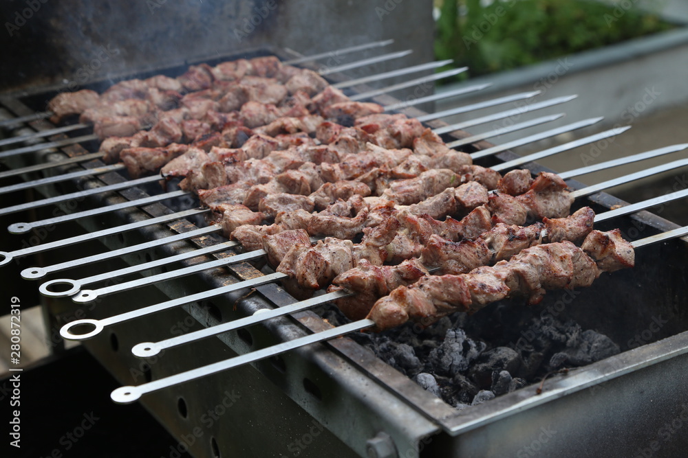 Roasted meat cooked at barbecue with smoke. Traditional eastern dish.