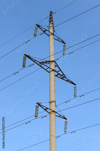 A power transmission line on a blue sky background