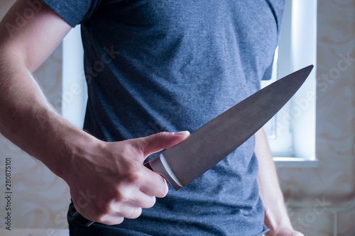 knife-wielding maniac. a crime of jealousy. a man threatens a kitchen knife at home