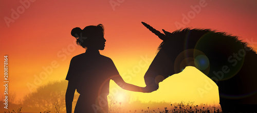 unicorn and girl at sunset