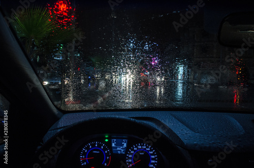car dashboard on rainy night