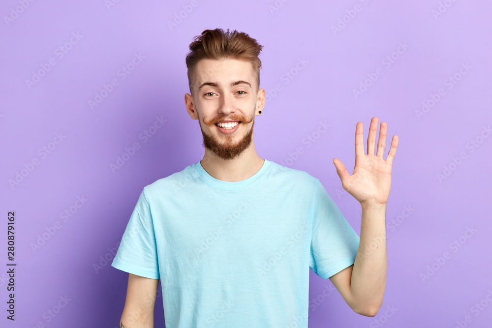 Positive cheerful man showing his open palm human emotions, facial