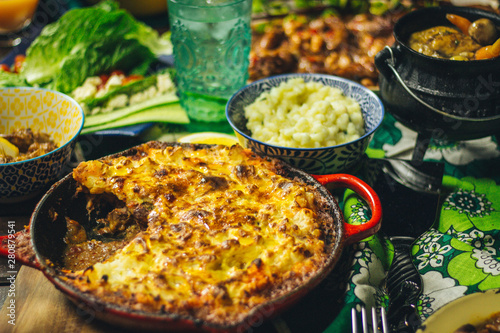 Chicken Liver Cottage Pie with Samp and Salad on Wooden Deck photo