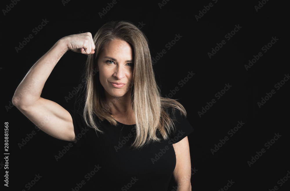 Beautiful middle aged woman on black background with space for text Beautiful middle aged woman on black background with space for text