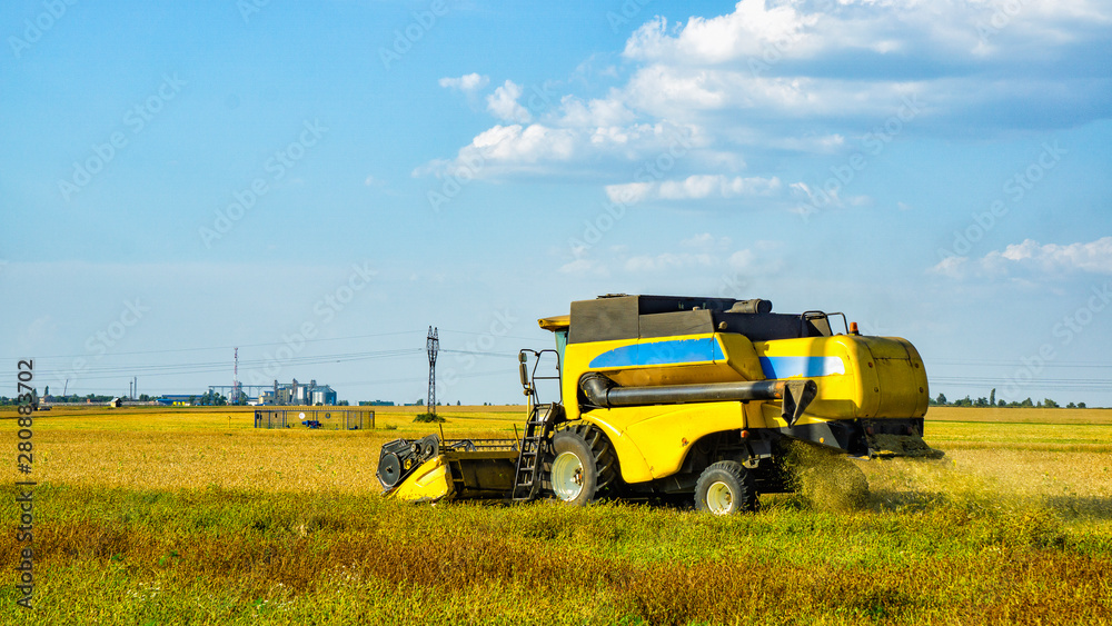 The harvesting mechanism cleans the wheat The harvesting mechanism cleans the wheat