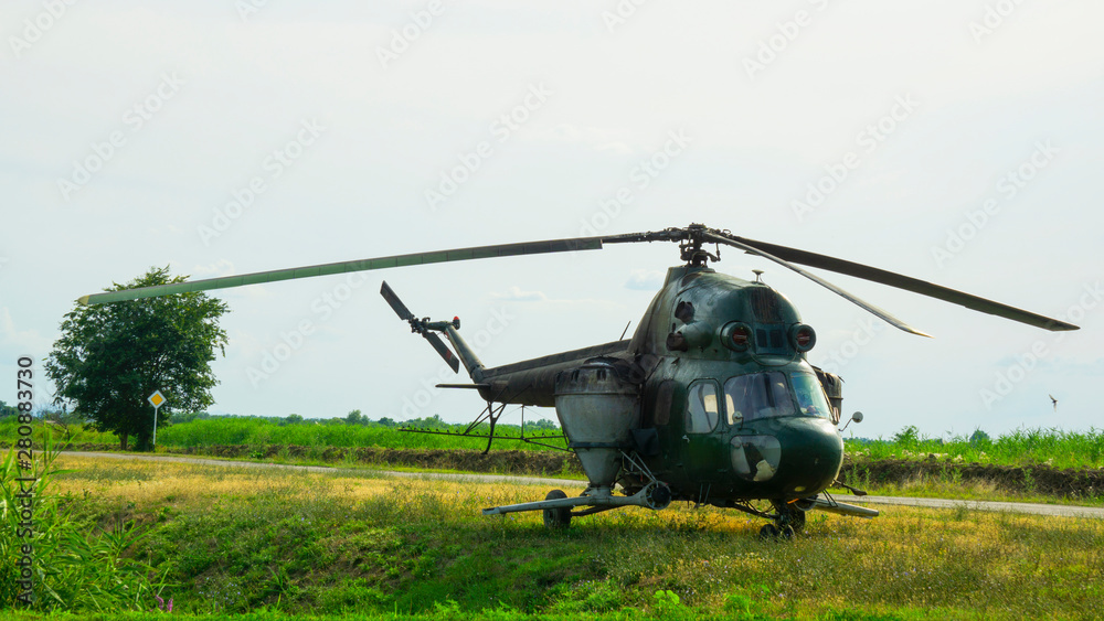 A helicopter equipped with equipment for spraying chemicals A helicopter equipped with equipment for spraying chemicals