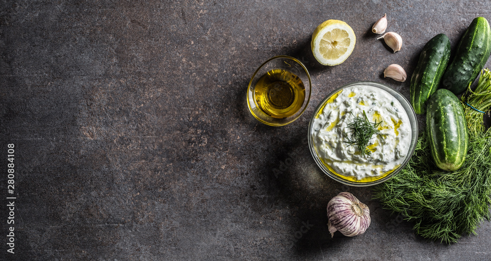 Tzatziki sause in a glass bowl dill cucumber olive oil lemon and garlic Tzatziki sause in a glass bowl dill cucumber olive oil lemon and garlic