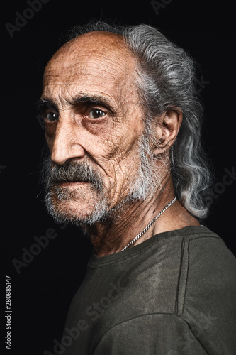 profile of senior man with gray hair and bold with serious expression. close up side view portrait.philosopy of life. senility concept. decline