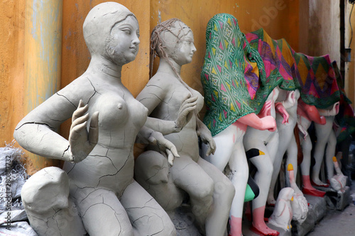 Idol of Hindu Goddess Lakshmi during preparations in Kolkata. Clay idol of Goddess Lakshmi, under preparation for Bengal`s Lakshmi Puja festival at Kumartuli Kolkata.  photo