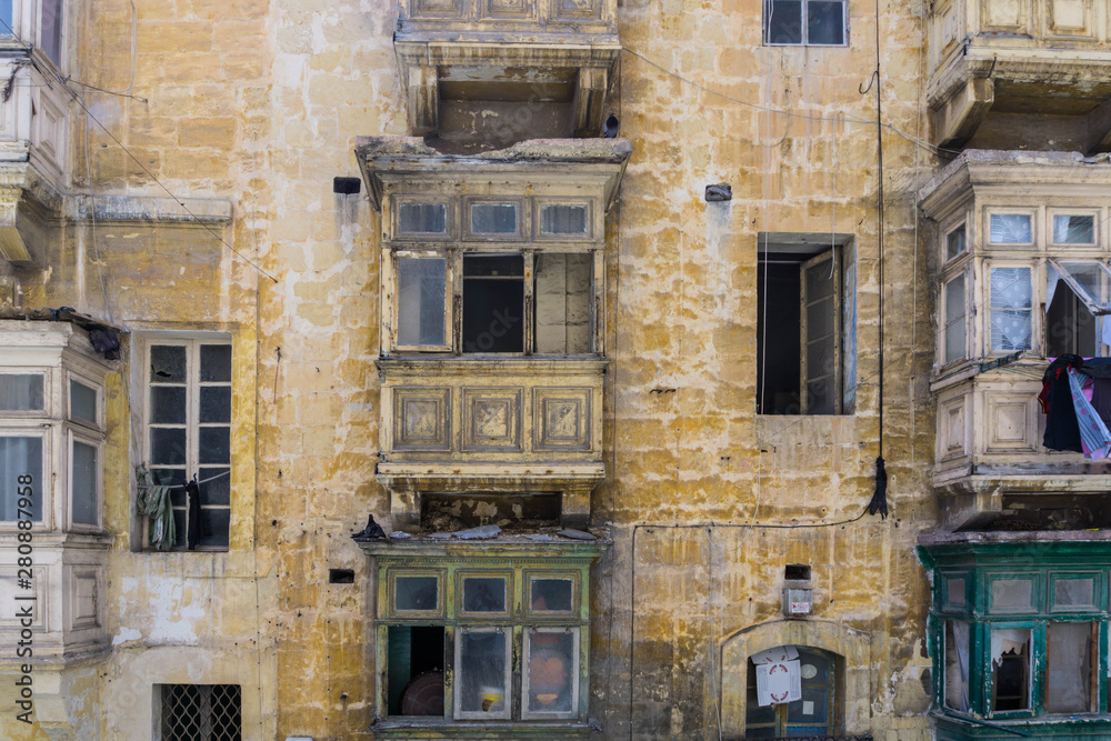 Run down old houses along a street in the unesco world heritage city of valletta, capital of malta
