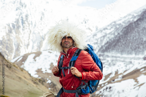 Hiker with traditional papakha fur hat at Mtskheta-Mtianeti region in Georgia © BGStock72