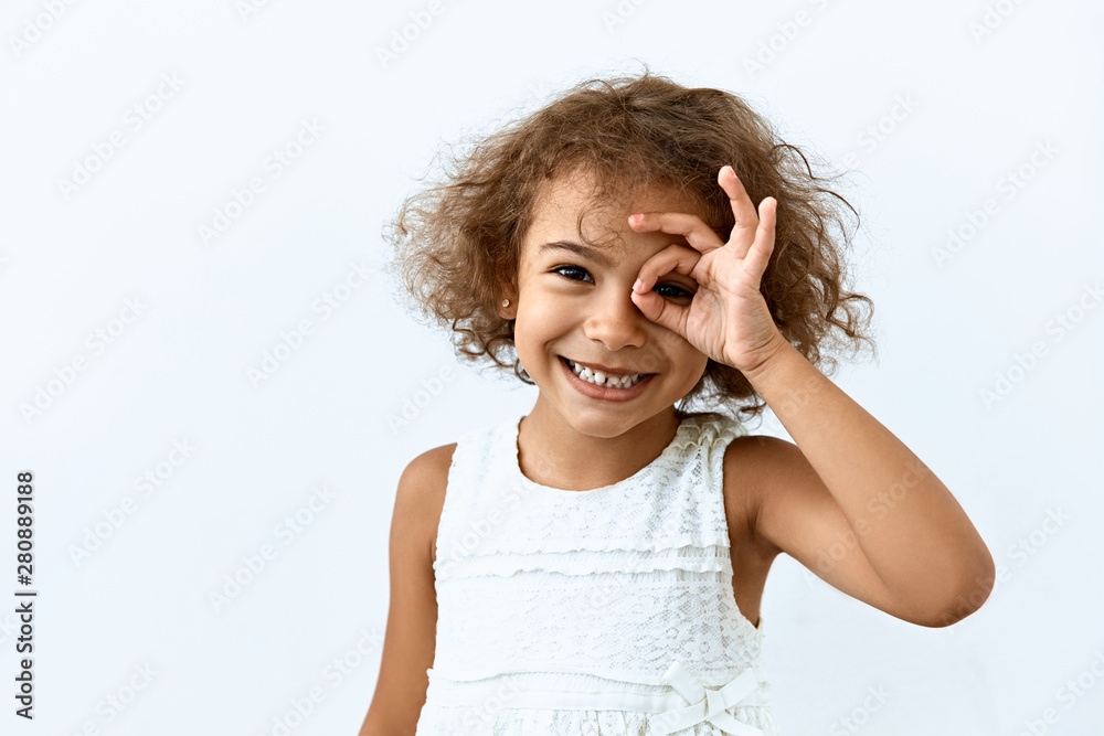 Okay symbol. Portrait of Little African American girl who a showing agree and approval sing. Okay symbol. Portrait of Little African American girl who a showing agree and approval sing.