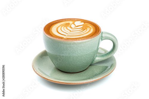 Side view of hot latte coffee with latte art in a ceramic green cup and saucer isolated on white background with clipping path inside.