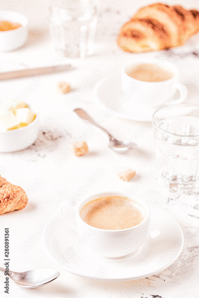 Traditional breakfast with fresh croissants on white background. Traditional breakfast with fresh croissants on white background.