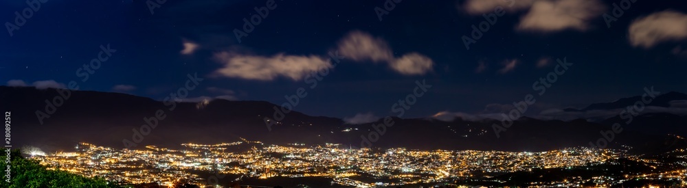City panorama at night made with several pictures put together in software. This is San Cristobal in Venezuela during night.