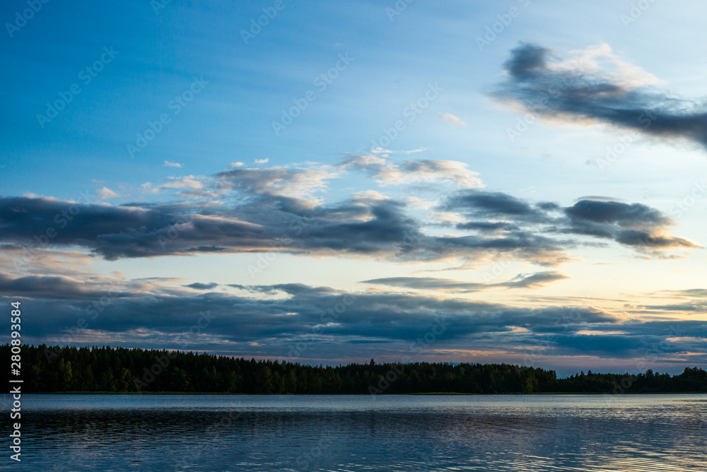 Obraz premium Sunset on the shores of the calm Saimaa lake in the Kolovesi National Park in Finland - 2