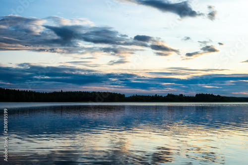 Fototapeta Naklejka Na Ścianę i Meble -  Sunset on the shores of the calm Saimaa lake in the Kolovesi National Park in Finland - 3