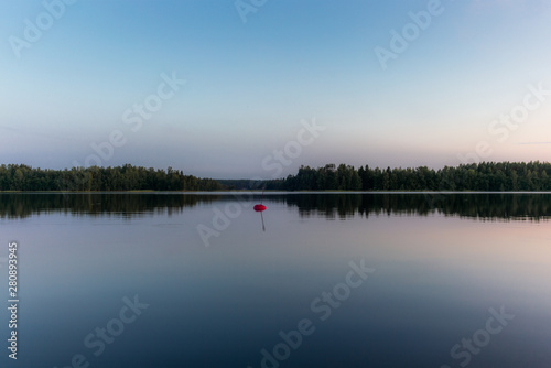 Reflections on the calm waters of the Saimaa lake in Finland at Sunset - 6