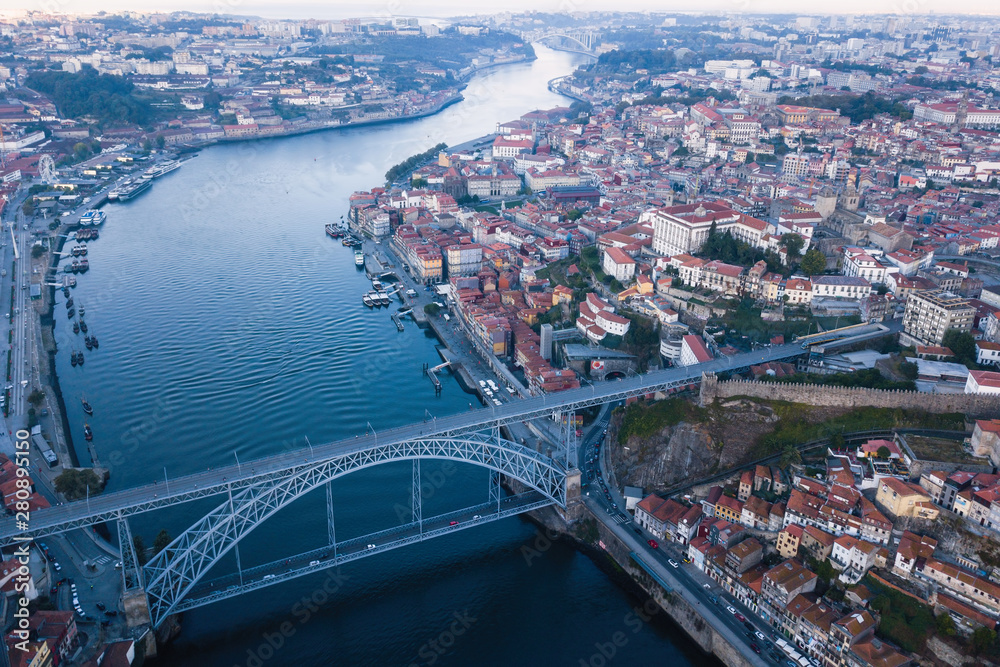 Aerial view of Douro river and Dom Luis I bridge in Porto, Portugal.