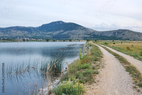 Fototapeta Naklejka Na Ścianę i Meble -  Road on a lake near Tommislavgrad in Croatia
