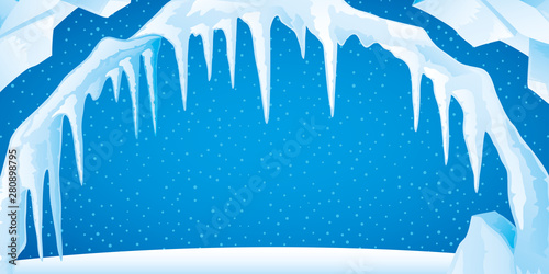 Ice with icicles and snow on a blue background.