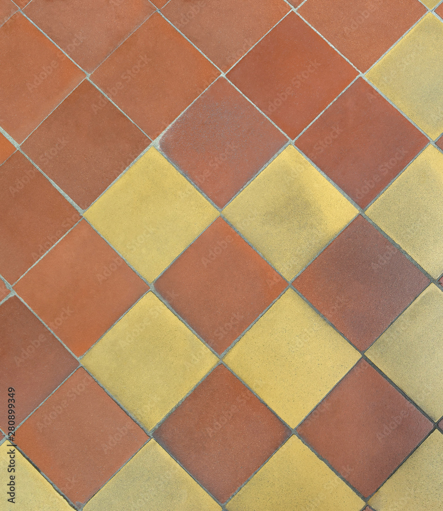  Old shabby square ceramic floor tiles (mettlach tiles). Background texture. Diagonal chequered pattern. Top view. 