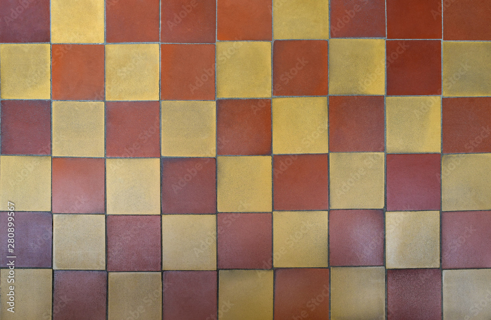 Old shabby square ceramic floor tiles (mettlach tiles). Background texture. Chequered pattern. Top view. Old shabby square ceramic floor tiles (mettlach tiles). Background texture. Chequered pattern. Top view.