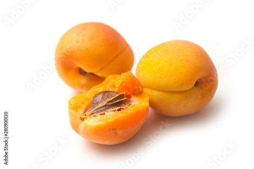 Closeup of organic apricots on white background