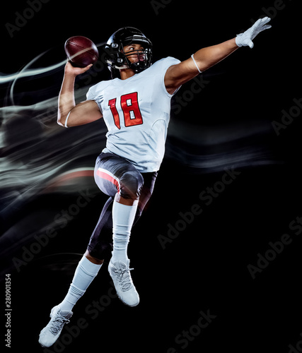 one african american football player man studio shot isolated on black background with light painting with blurred motion speed effect photo