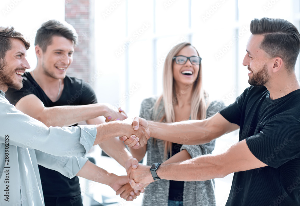 Fototapeta premium Happy smiling business team standing in a row at office.