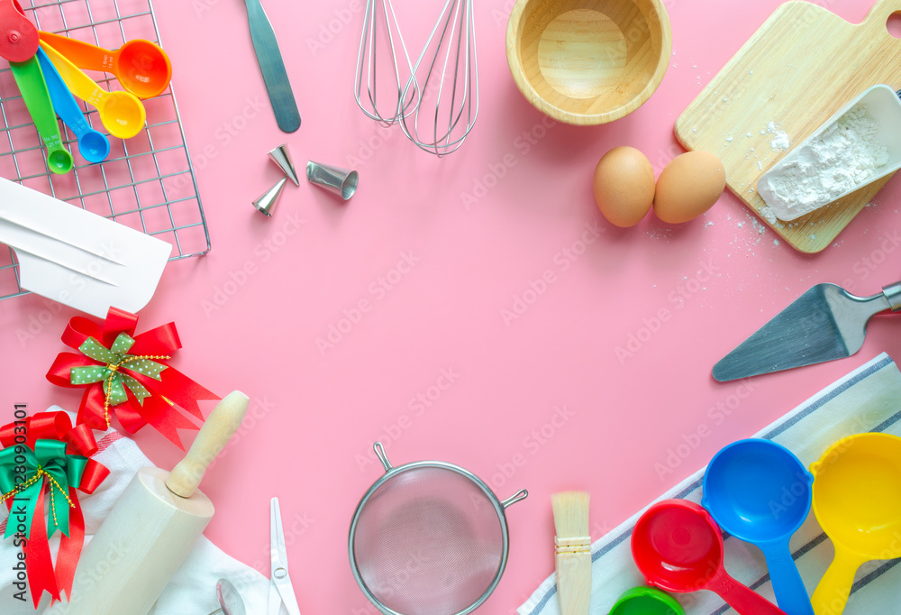 Baking utensils and ingredients is frame on pink pastel background. Text space images, top view. Baking utensils and ingredients is frame on pink pastel background. Text space images, top view.