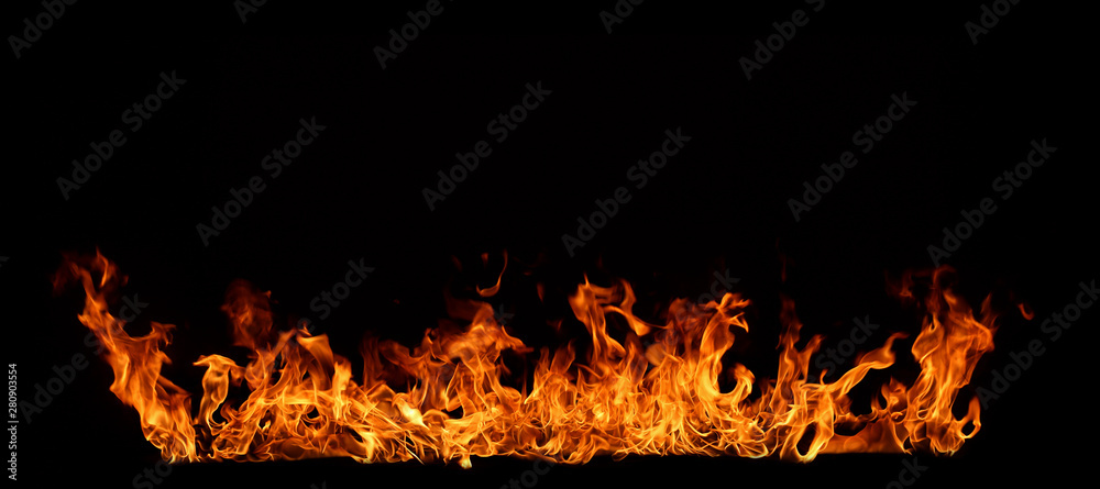 A red flame that is burning on a black background. A red flame that is burning on a black background.