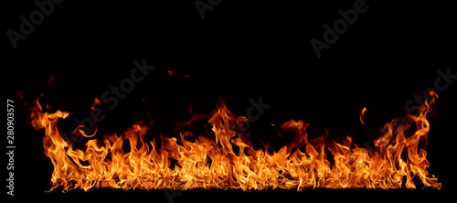 A red flame that is burning on a black background.