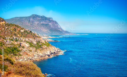 Cape Town  South Africa coastline with a fire in the far background.