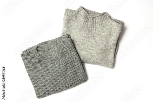 sweaters on a white background top view