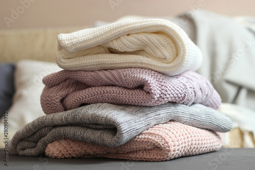 A stack of warm sweaters in the interior of the room.