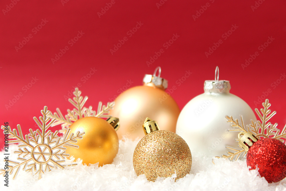 Christmas balls and snow on a colored background. Christmas and New Year background. Christmas balls and snow on a colored background. Christmas and New Year background.