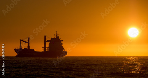 Cape Town, South Africa ship silhouette at sunset.