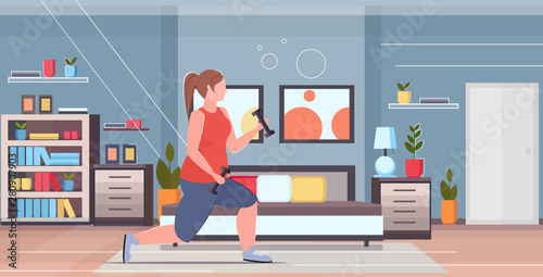 fat obese woman doing squats exercises with dumbbells overweight girl training workout weight loss concept modern house bedroom interior flat full length horizontal
