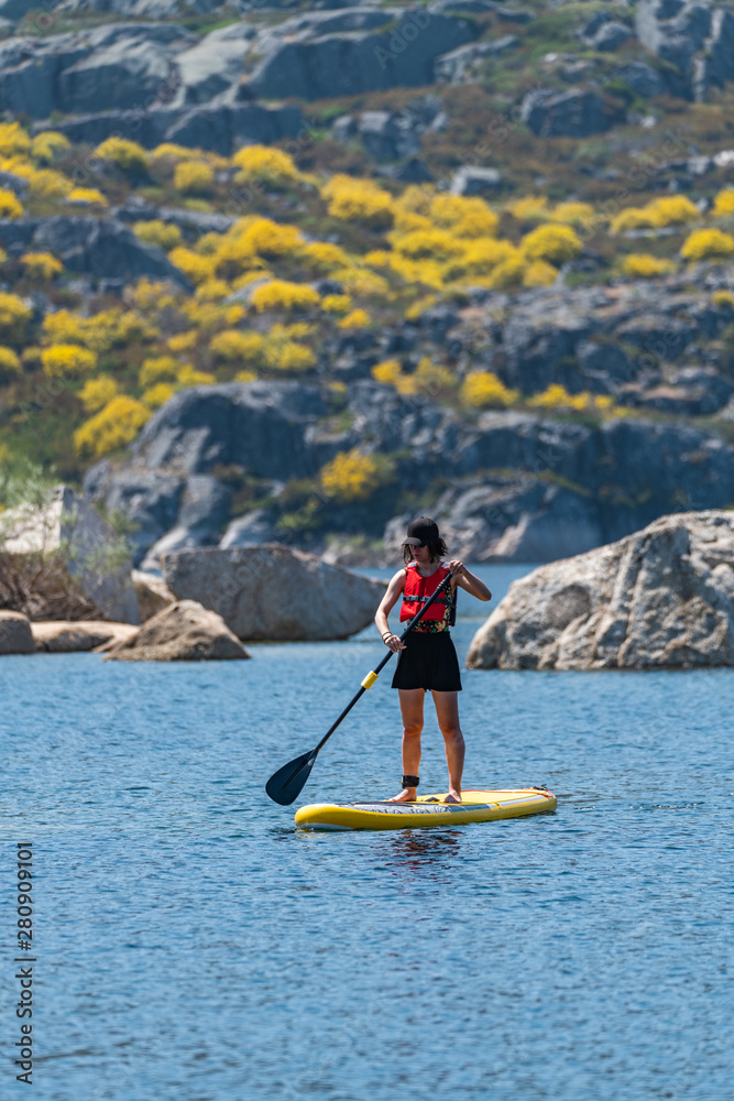 Naklejka premium Stand up paddle on a lake
