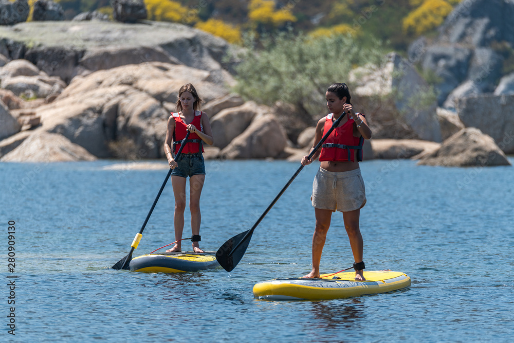 Naklejka premium Stand up paddle on a lake