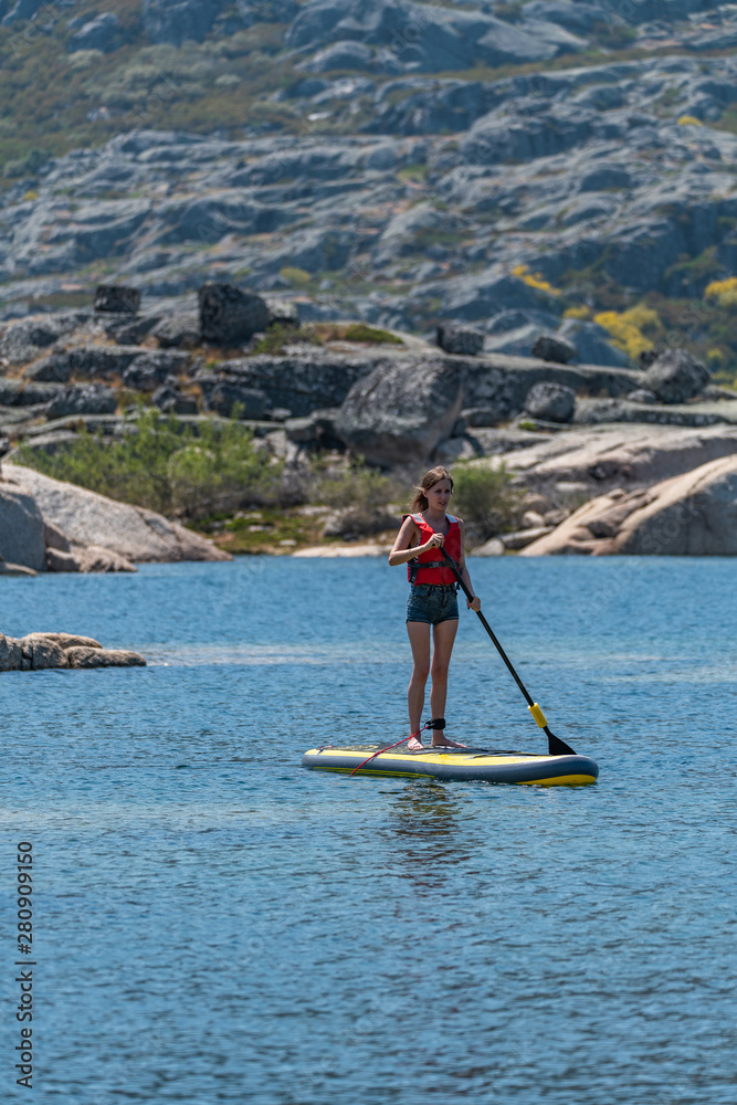 Naklejka premium Stand up paddle on a lake