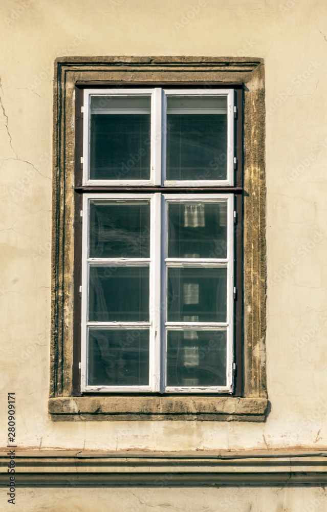 Old window in ancient facade