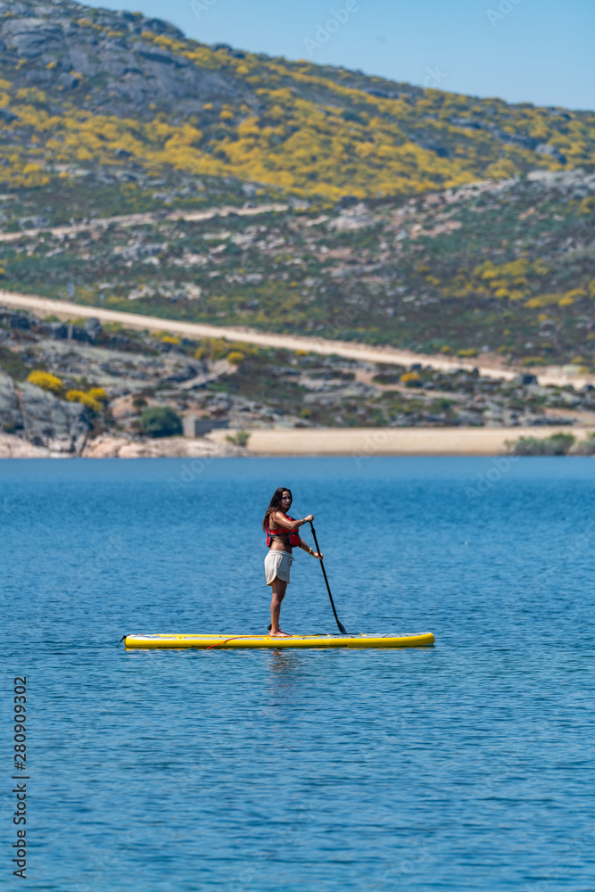 Naklejka premium Stand up paddle on a lake